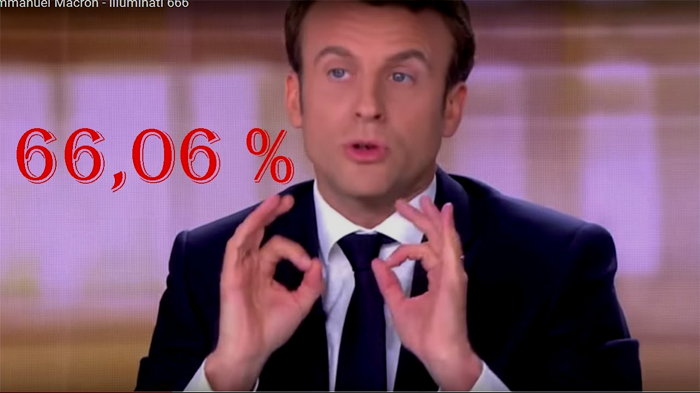 Emmanuel Macron flashant le double signe digital 666 face à Marine Le Pen  Capture d'écran TV TF1: débat du 4 Mai 2017